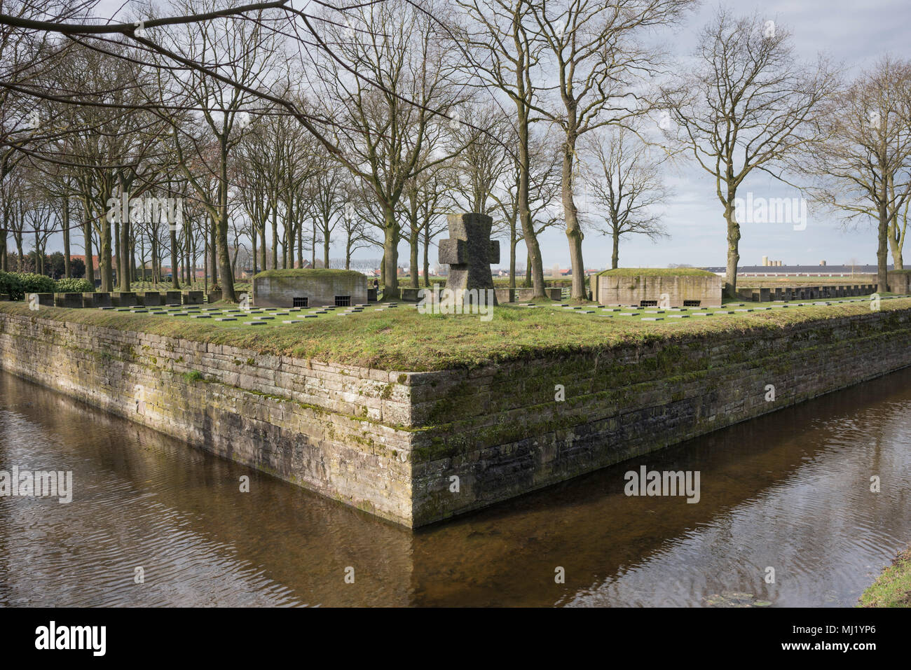 German military cemetery Langemark, with moat and large stone cross, First World War, Langemark Poelkapelle, West Flanders Stock Photo