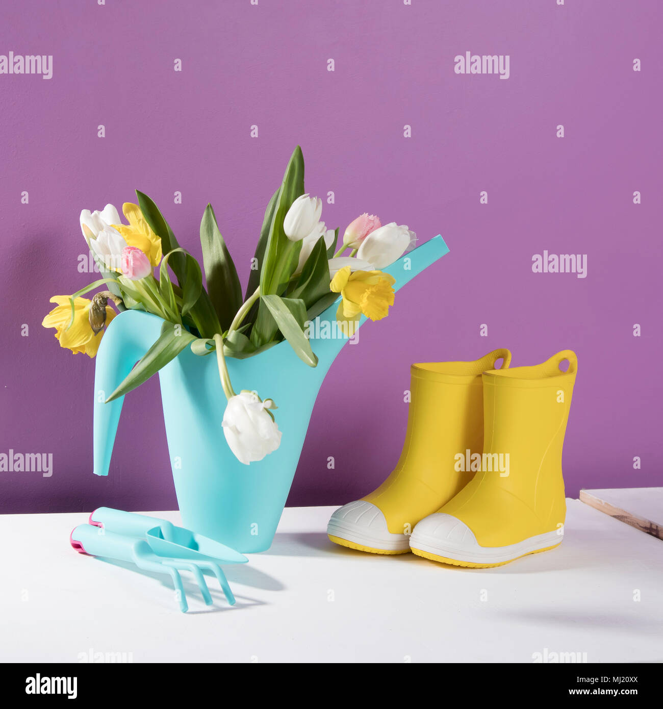 Yellow rubber boots with a bouquet of flowers of yellow daffodils and ...
