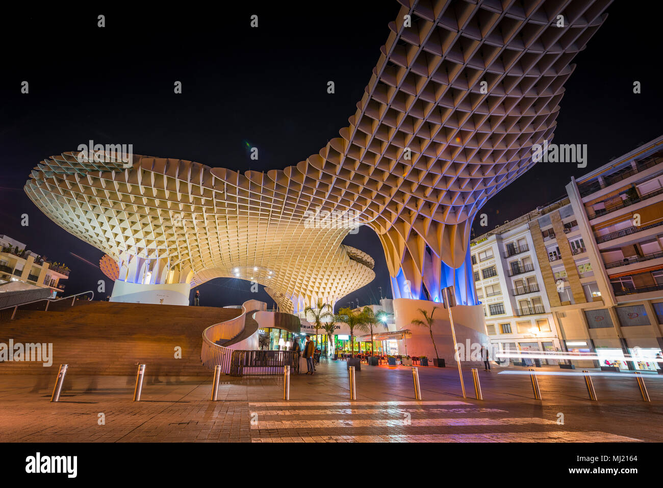 Modern architecture, wooden structure Metropol Parasol, illuminated, with traces of light at night, Plaza de la Encarnacion Stock Photo