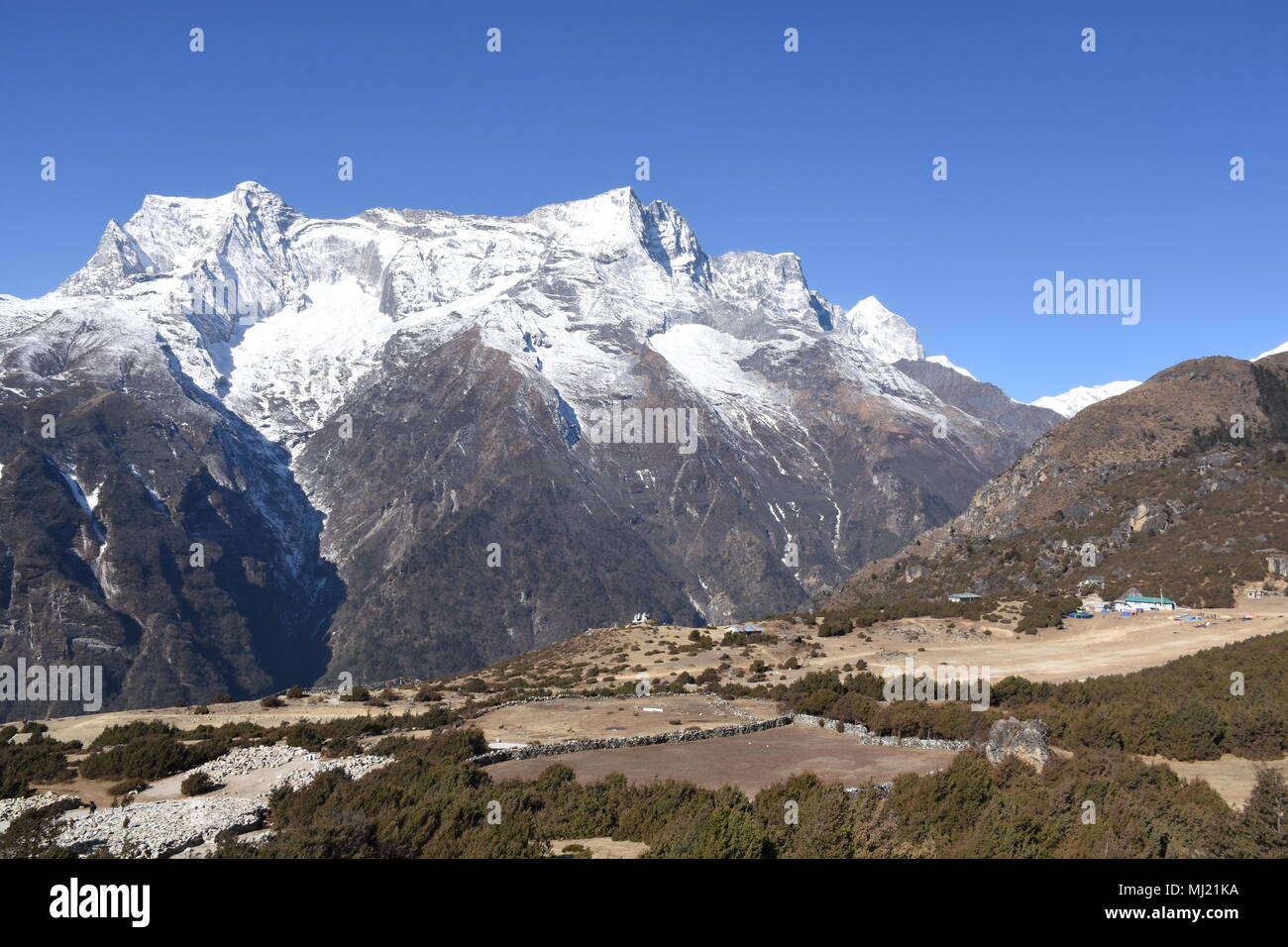 Namche Bazaar airstrip and Kongde Ri in the background Stock Photo