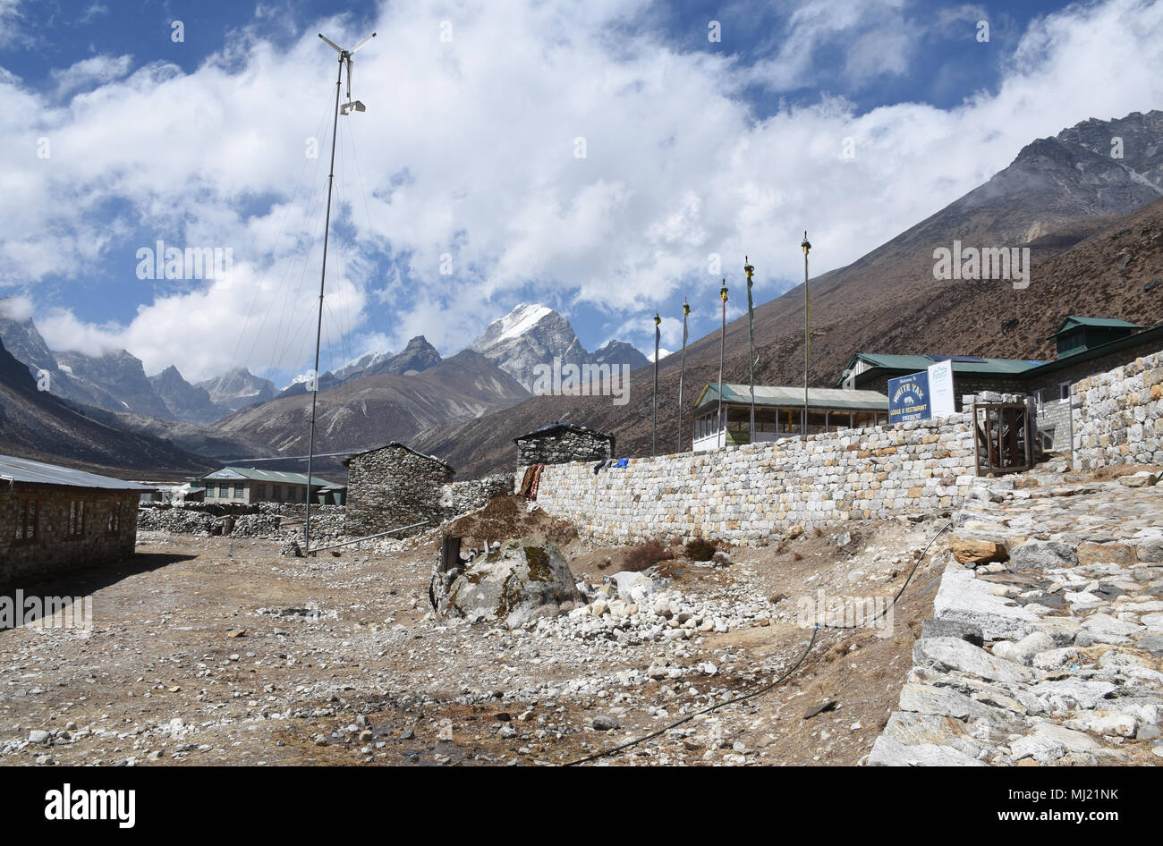 Pheriche, Nepal - March 16, 2018: White Yak Hotel in Pheriche with surrounding mountains Stock Photo