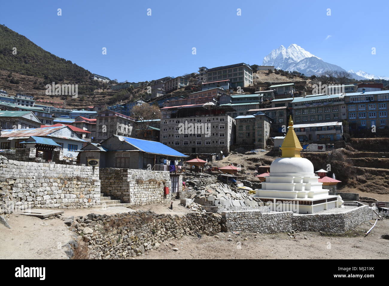 Stupa in Namche Bazaar and Mount Thamserku in the background Stock Photo