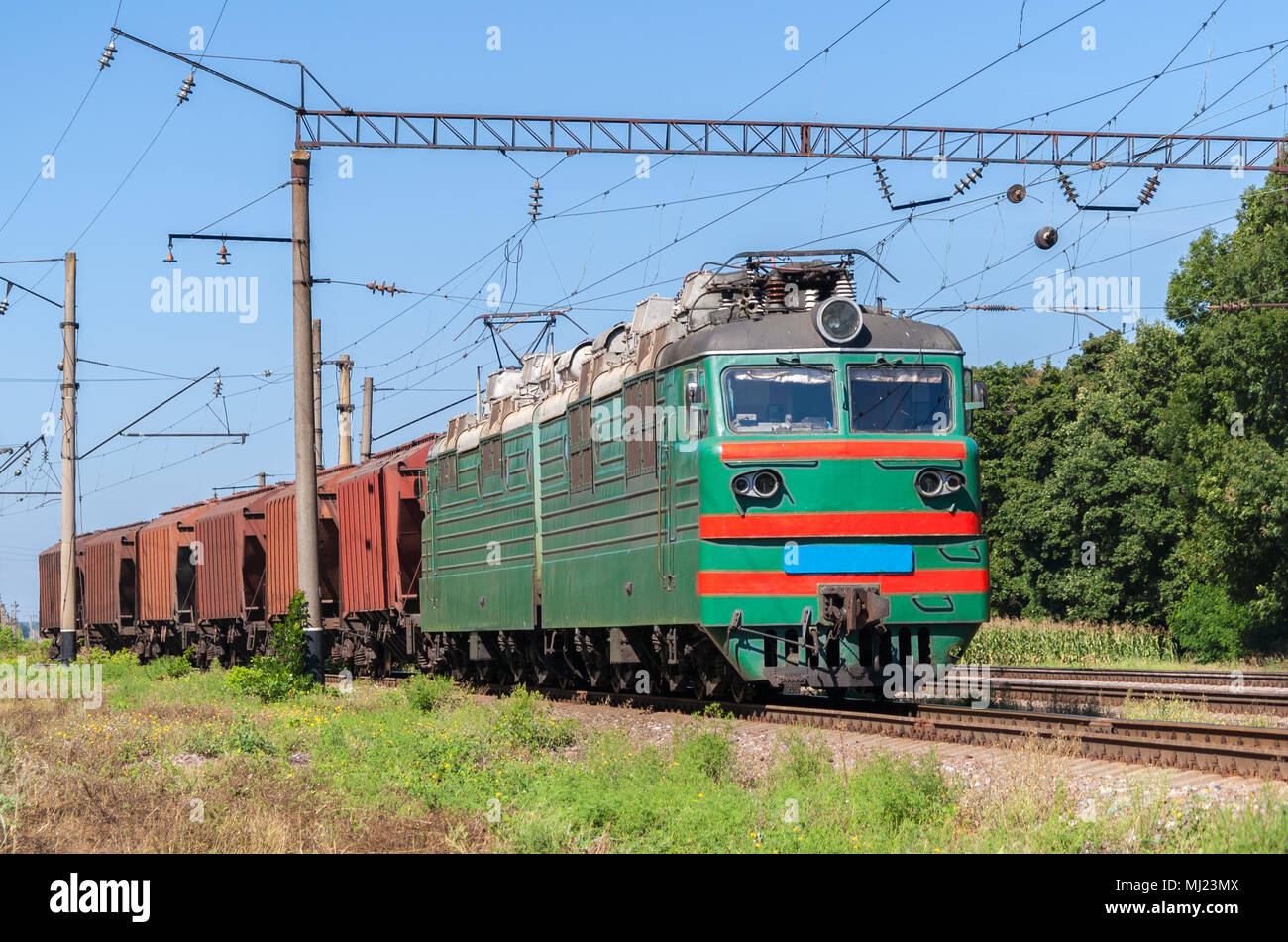 Electric locomotive hauling a grain train Stock Photo