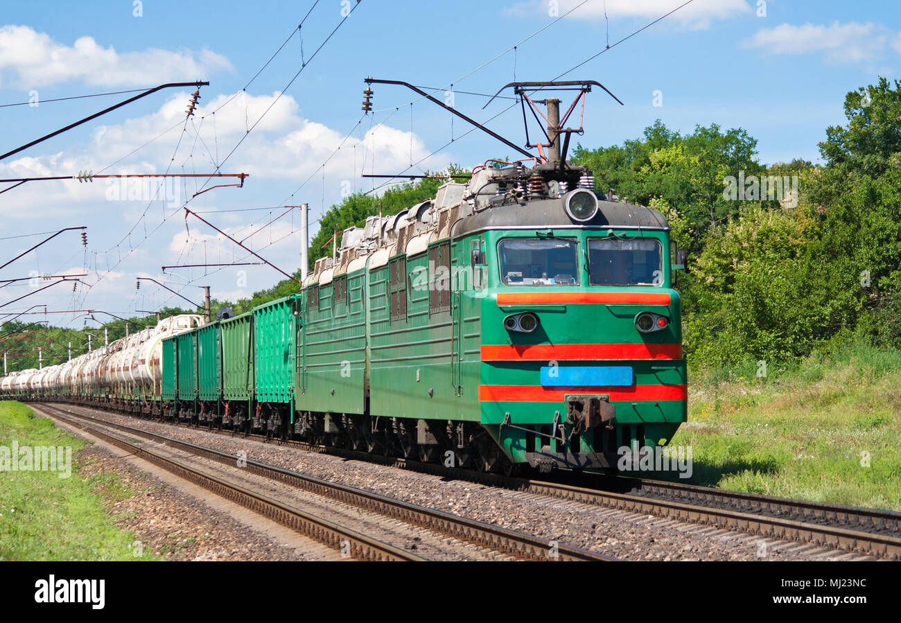 Electric locomotive pushing a cargo train Stock Photo