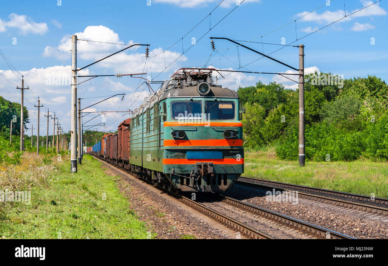 Electric locomotive hauling a cargo train Stock Photo