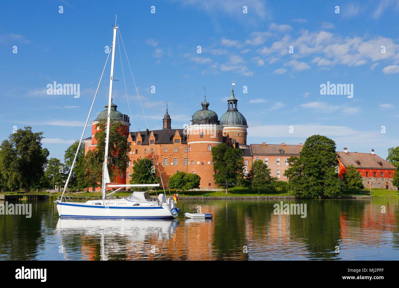 German flagged sailboat moored on lake Malaren in front of Gripsholm Castle in Mariefred, Sweden. Stock Photo
