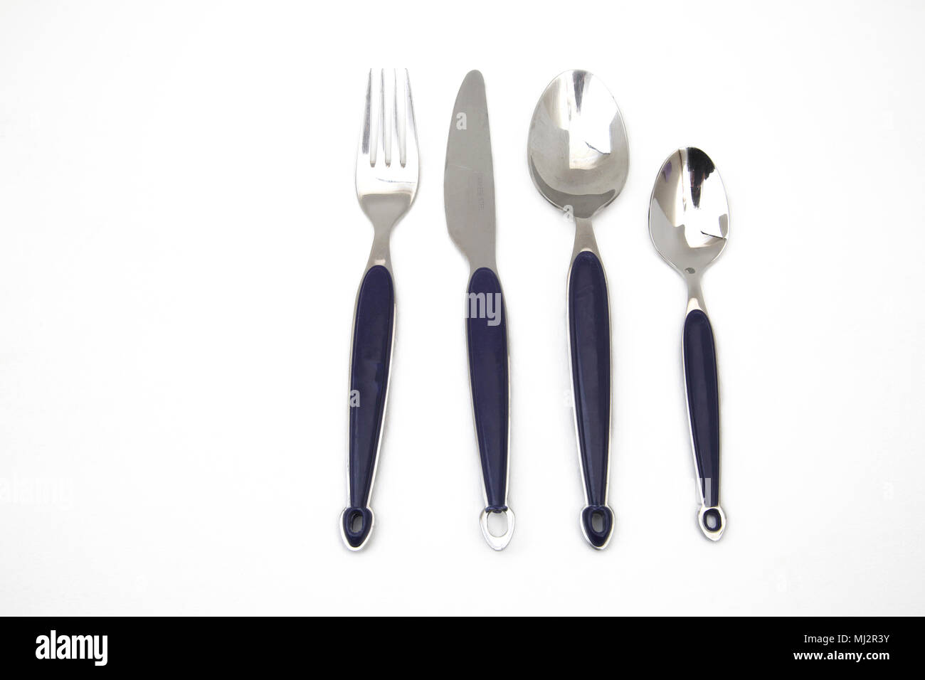 Set of Stainless Steel Cutlery With Blue Plastic Handles Stock Photo
