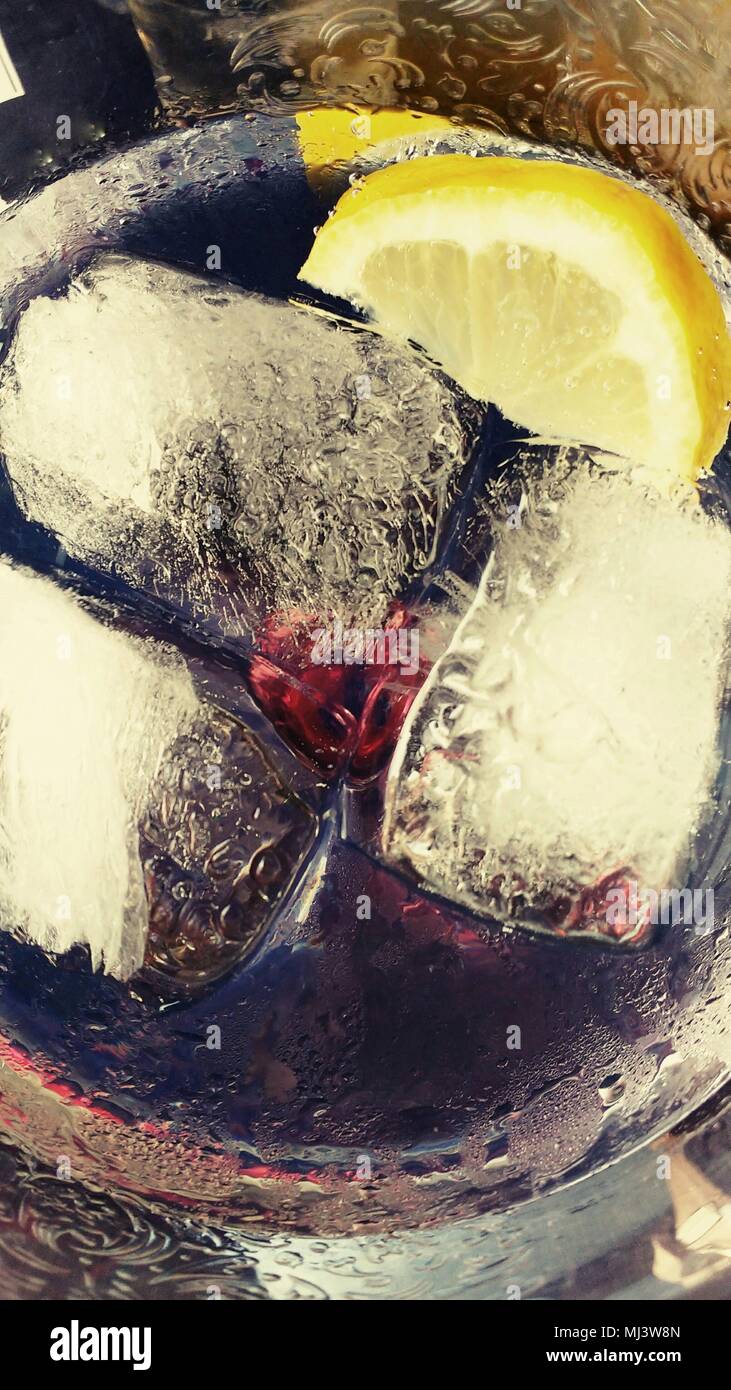 Gin and tonic on the rocks with lemon texture on a glass Stock Photo Alamy