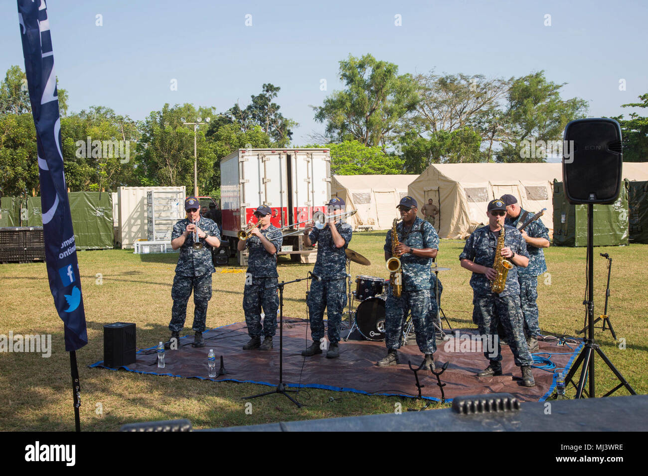 PUERTO CORTES, Honduras (March 20, 2018) The U.S. Fleet Forces Band performs at the Franklin D. Roosevelt School medical site in Puerto Cortes, Honduras, during Continuing Promise 2018. U.S. Naval Forces Southern Command/U.S. 4th Fleet has deployed a force to execute Continuing Promise to conduct civil-military operations including humanitarian assistance, training engagements, and medical, dental, and veterinary support in an effort to show U.S. support and commitment to Central and South America. (U.S. Army Image collection celebrating the bravery dedication commitment and sacrifice of U.S.  Stock Photo