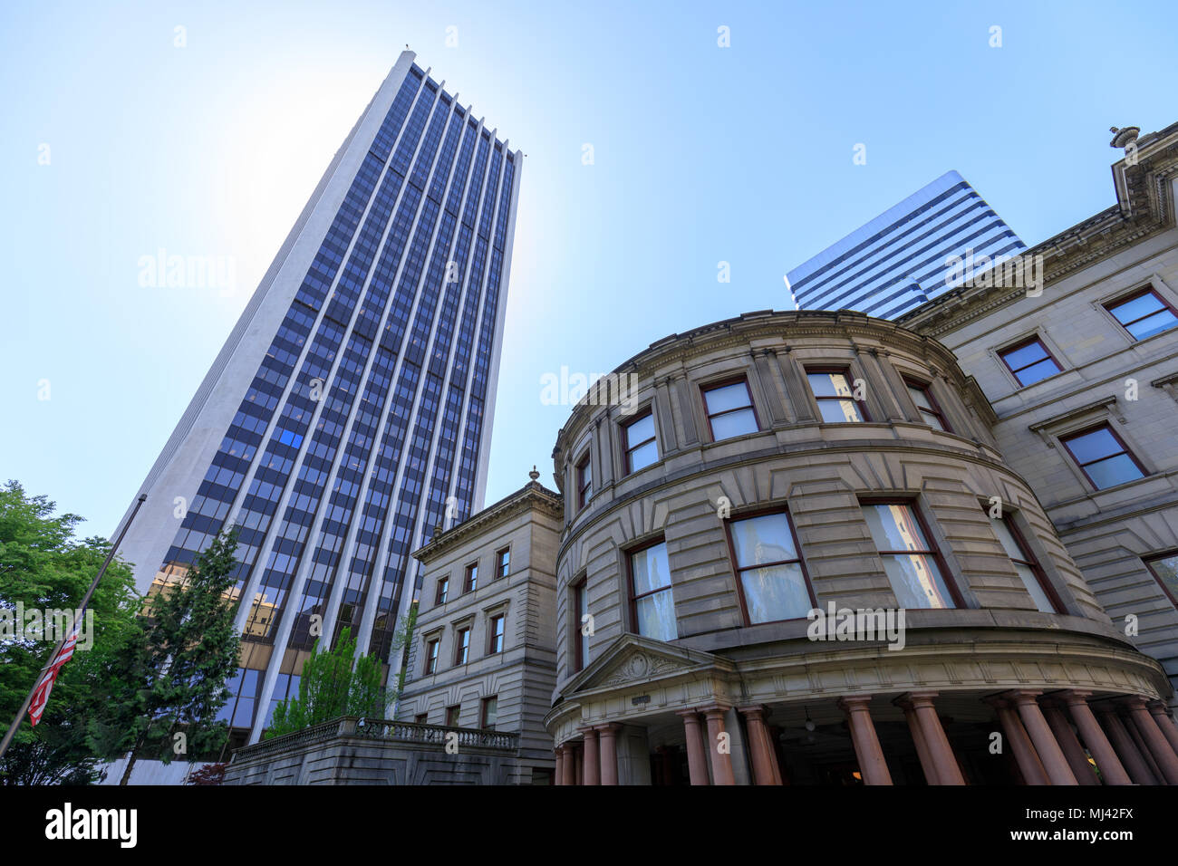 Portland, Oregon, USA - April 27, 2018 : The building of Wells Fargo Center with Portland city hall Stock Photo