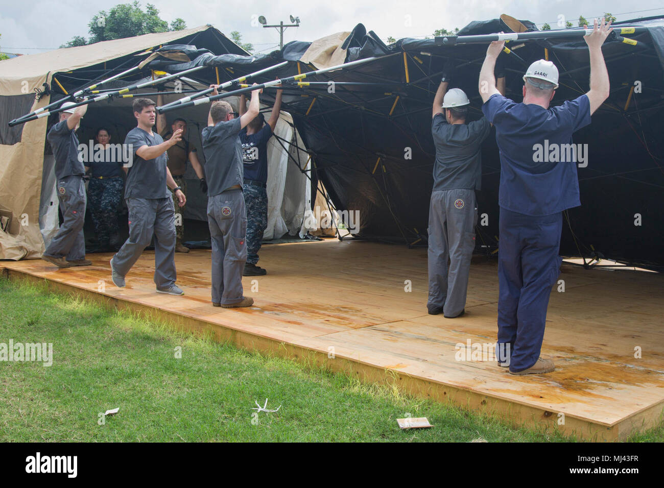 PUERTO CORTES, Honduras (March 23, 2018) Sailors disassemble a tent in preparation for departure from Honduras at the Franklin D. Roosevelt School during Continuing Promise 2018. U.S. Naval Forces Southern Command/U.S. 4th Fleet has deployed a force to execute Continuing Promise to conduct civil-military operations including humanitarian assistance, training engagements, and medical, dental, and veterinary support in an effort to show U.S. support and commitment to Central and South America. (U.S. Army Image collection celebrating the bravery dedication commitment and sacrifice of U.S. Armed F Stock Photo
