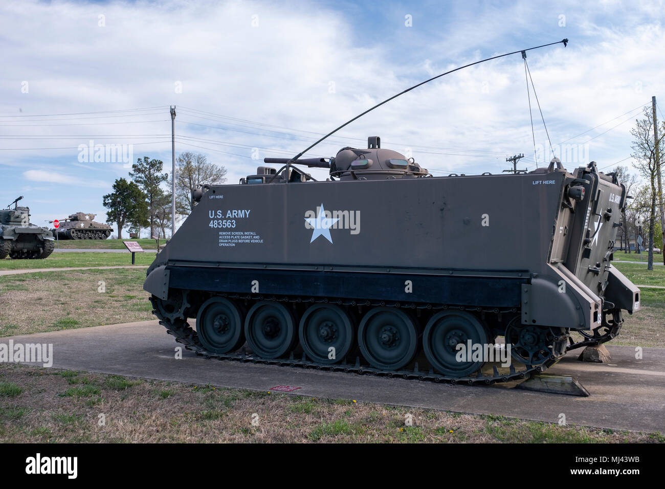 Armored Personnel Carrier. An outdoor military vehicle complex featuring vehicles used throughout military history eras. Stock Photo