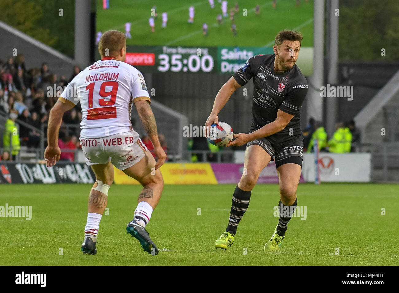 3rd May 2018, Totally Wicked Stadium, St Helens, England; Betfred Super League rugby, Round 14, St Helens v Catalans Dragons; Jon Wilkin of St Helens looks to pass before the tacke from Micky McIlroum of Catalans Dragsons Stock Photo