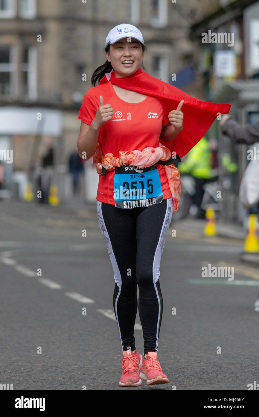 A female runner of the 2018 Stirling Scottish Marathon passing through Murray Place, Stirling during the final leg of the event. Stock Photo