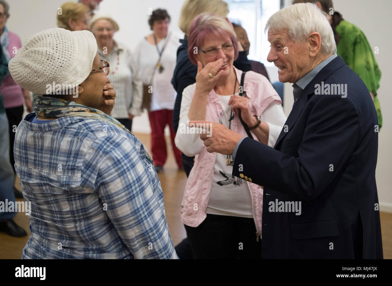 11 April 2018, Germany, Frankfurt: Elderly people take part in a special  flirting class for senior citizens. In short role-play games senior citizens  are learning how to open up towards people they