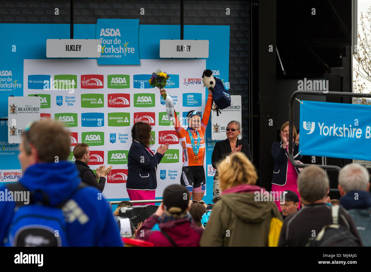 West Yorkshire, UK. 4th May 2018.  American Megan Guarnier receiving her medal, flowers and cuddly toy on the podium of the Cow and Calf Summit Finish after winning Stage Two of the women's Tour de Yorkshire. Rebecca Cole/Alamy Live News Stock Photo