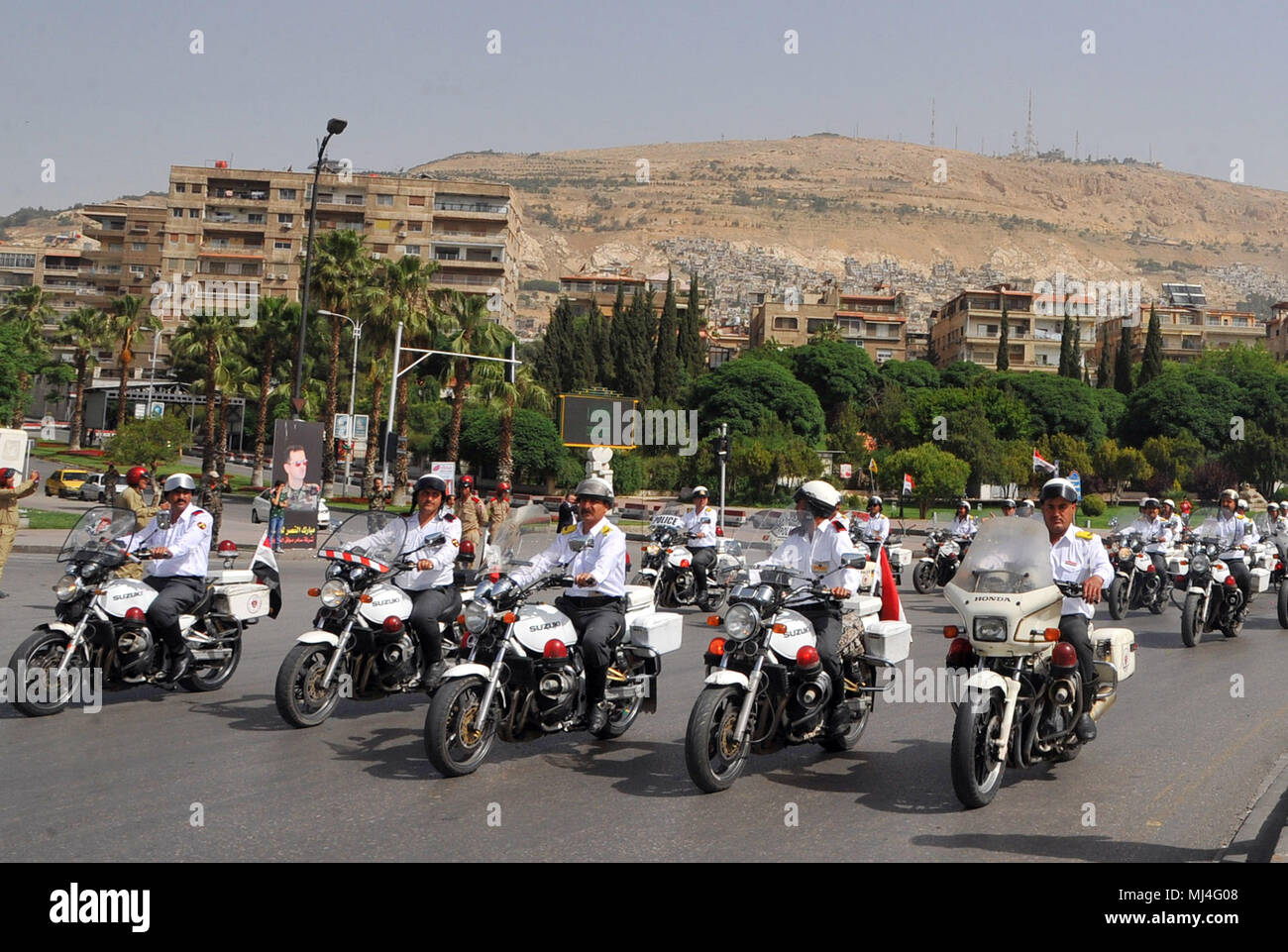 Damascus, Syria. 4th May, 2018. Syrian traffic police ride motorcycles