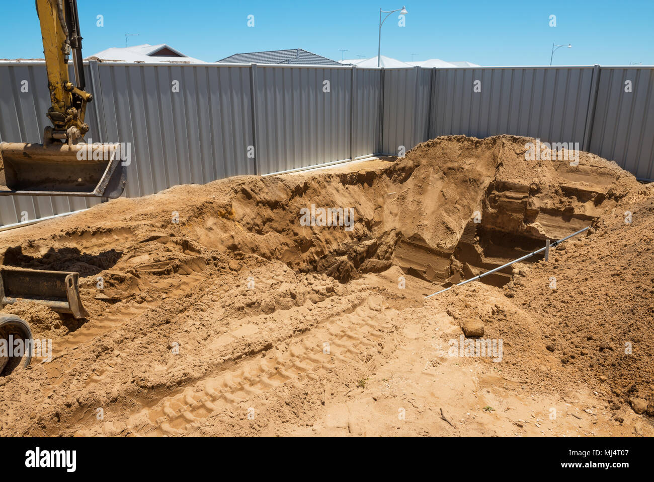 Excavation works for the installation of a swimming pool.Swimming pool under construction. Stock Photo