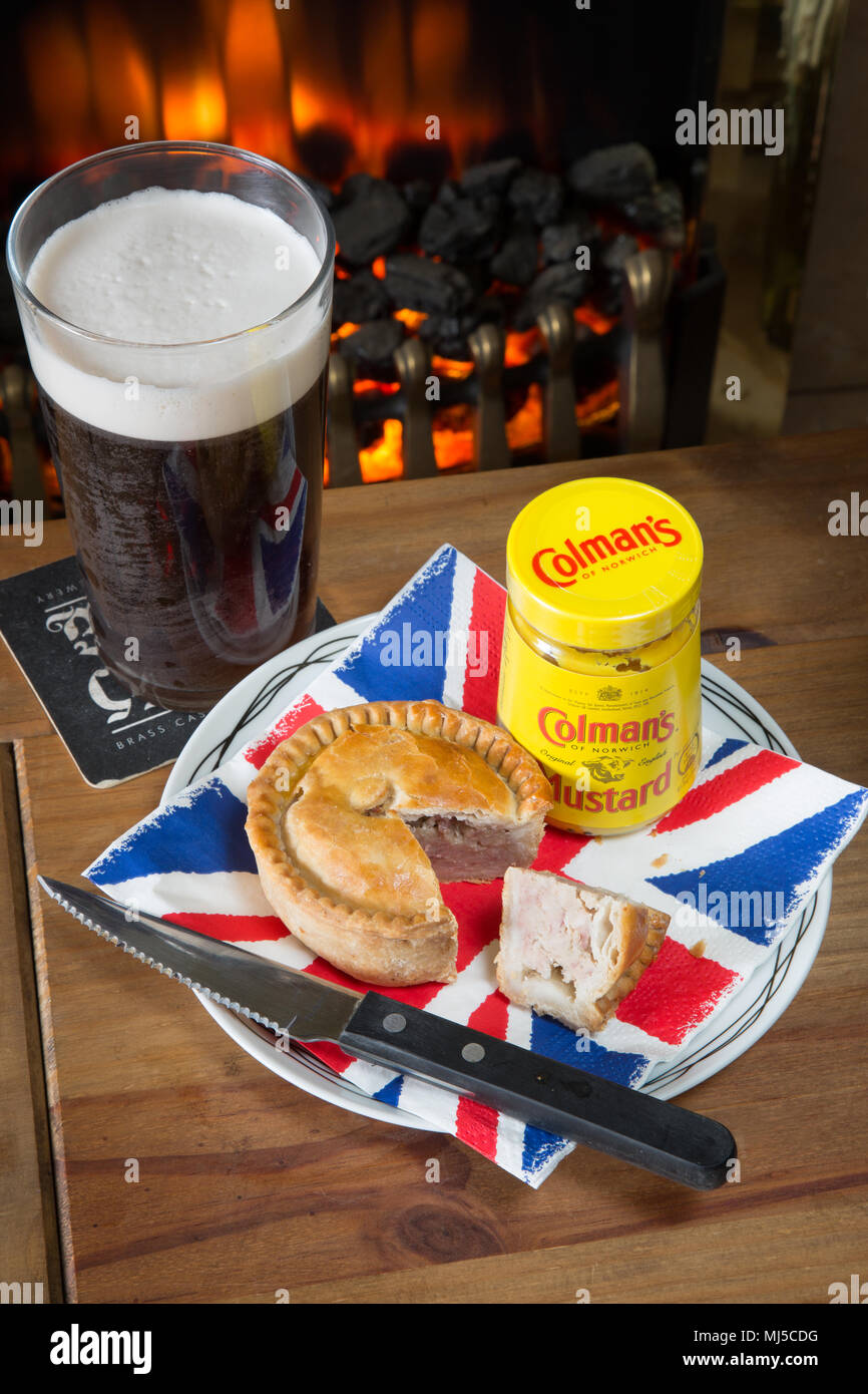 An English pub classic snack of Pork pie with Coleman's English mustard Stock Photo Alamy