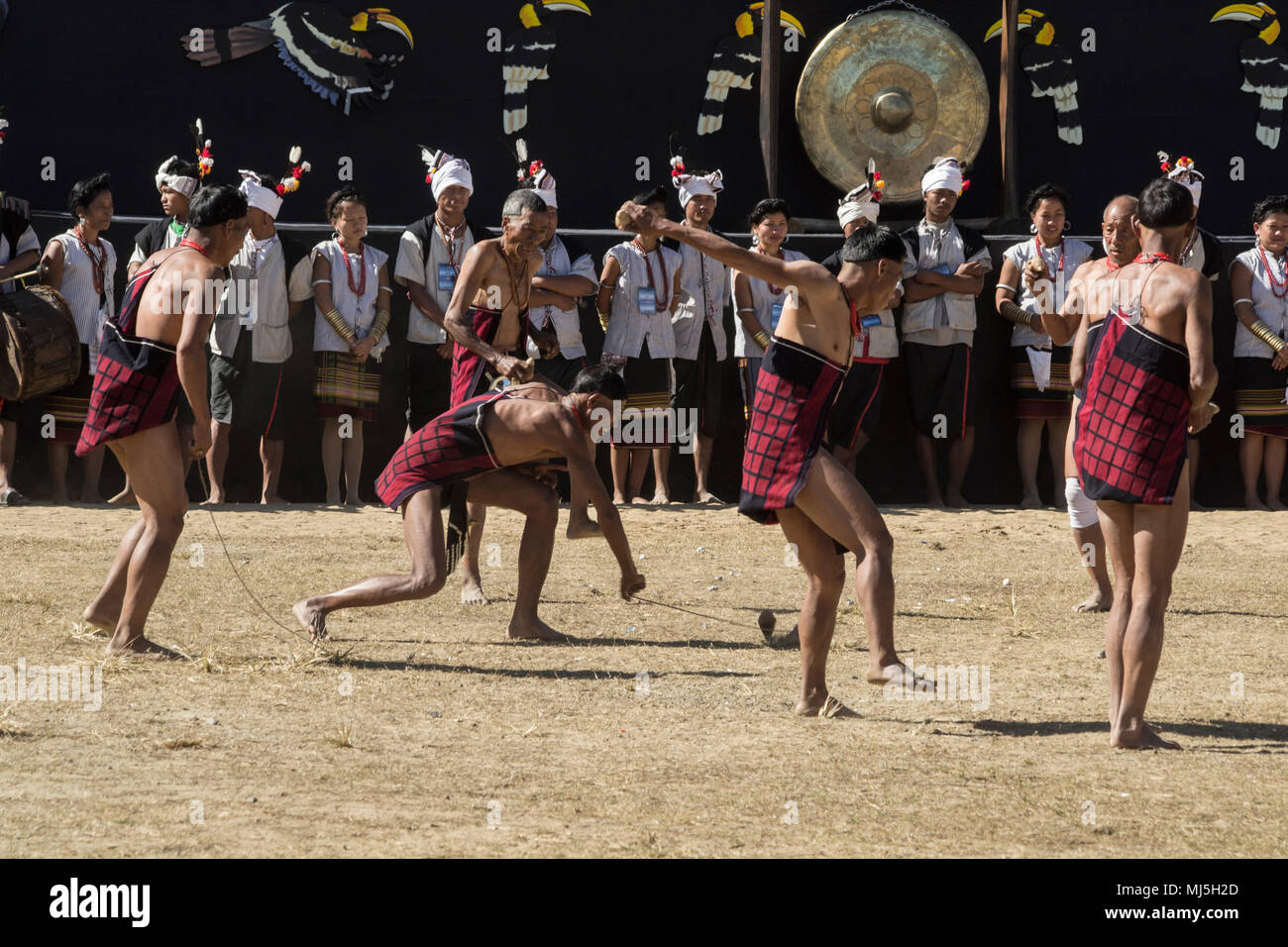 Naga Heritage Village, India. Demonstration of Naga games, performed during the lunchbreak of the Hornbill Festival Stock Photo