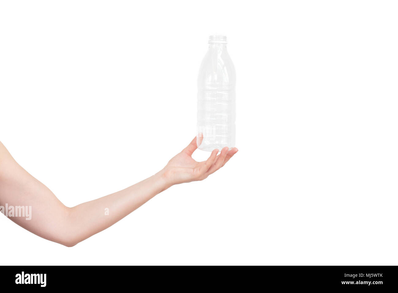 Female hand holding empty plastic bottle isolated on white. Recyclable
