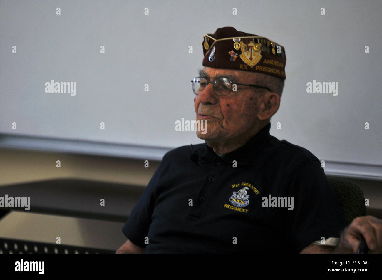 Paul Kerchum, a Chief Master Sgt. (Ret.) with the Air Force and the Army Air Corps, describes his experiences in World War II and his involvement in the Bataan Death March to a crowd of visitors at White Sands Missile Range, New Mexico, March 24, 2018.  Thousands of prisoners of war died in the Bataan Death March, a forced relocation of prisoners in April 1942 through inhospitable jungle, who were denied proper food, water and medical attention.  (U.S. Army Image collection celebrating the bravery dedication commitment and sacrifice of U.S. Armed Forces and civilian personnel. Stock Photo