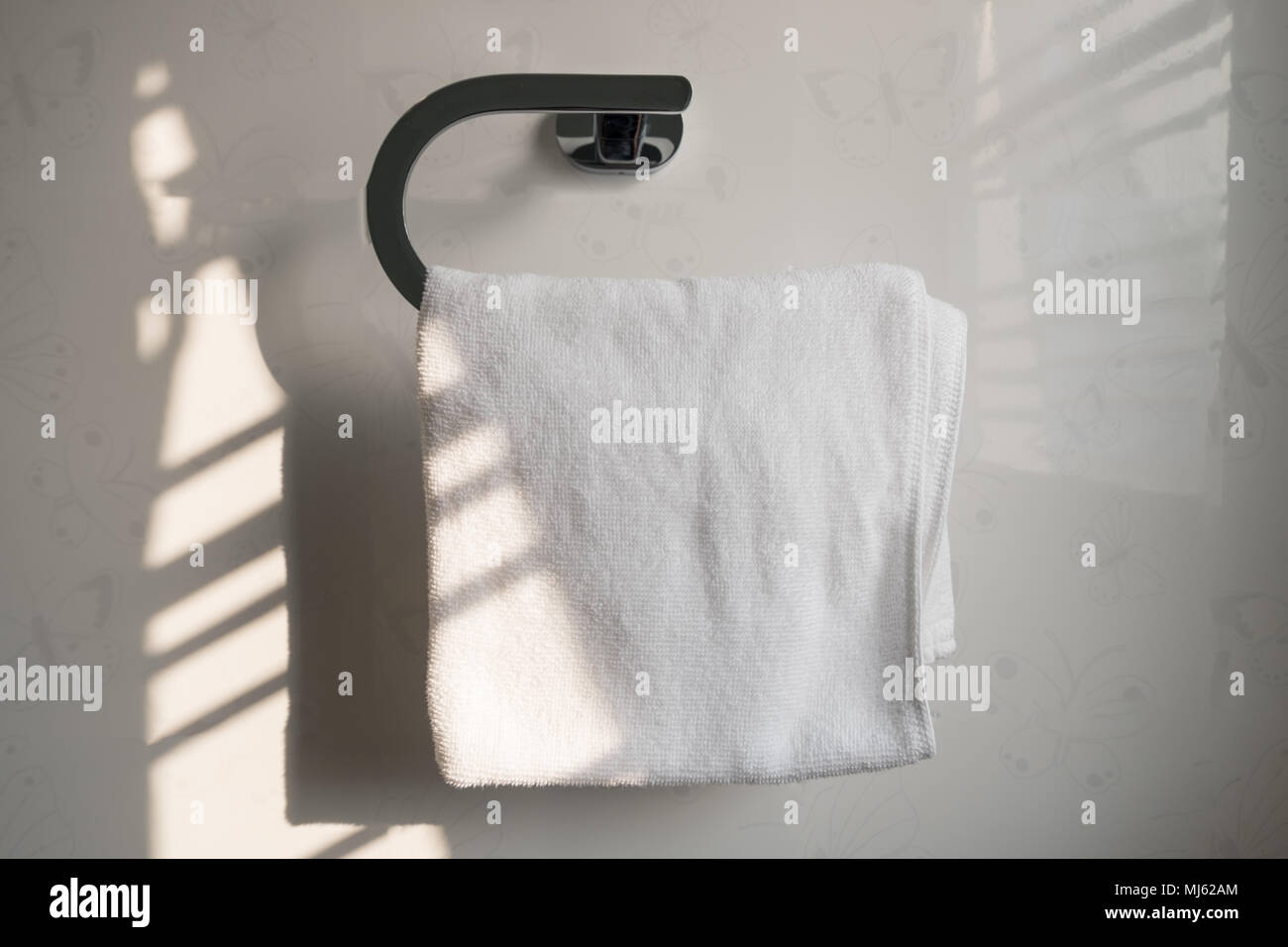 White clean towel on the steel shelf in bathroom Stock Photo Alamy
