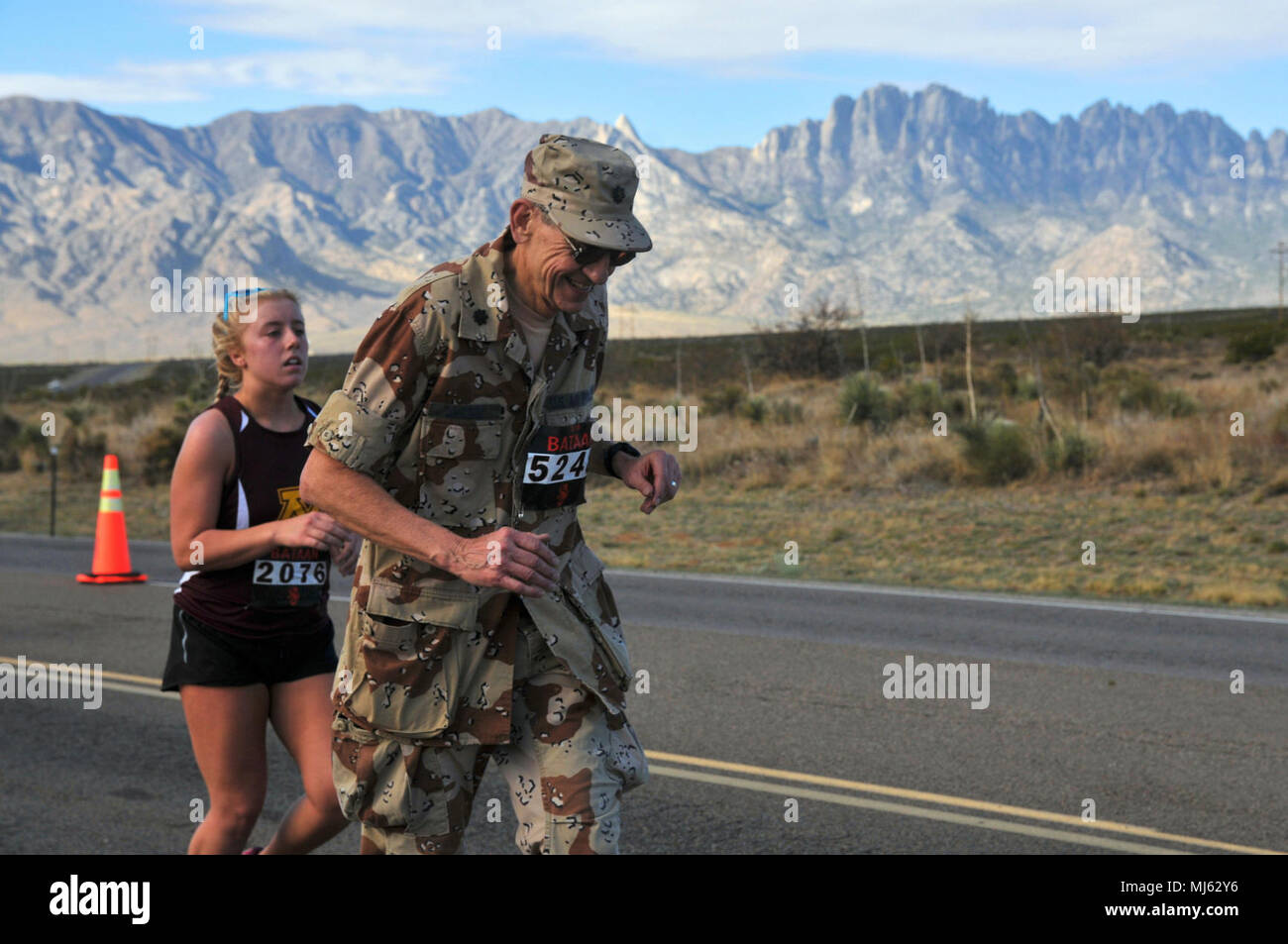 Participants in the 2018 Bataan Memorial Death March run along a 26.2-mile  course against the backdrop of the Organ Mountains in White Sands Missile  Range, N.M., March 25, 2018. The march fosters
