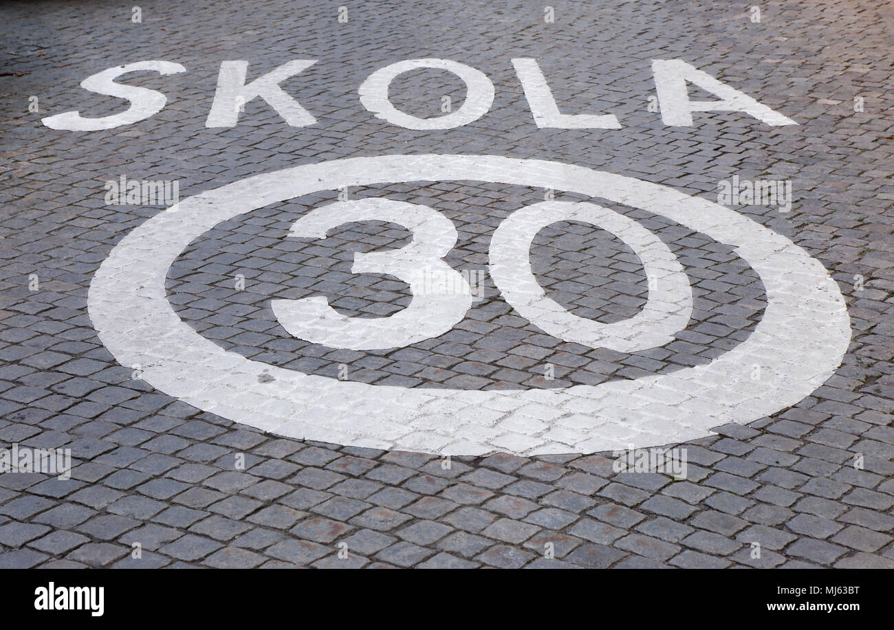 Speed limit 30 outside Swedish School. Stock Photo