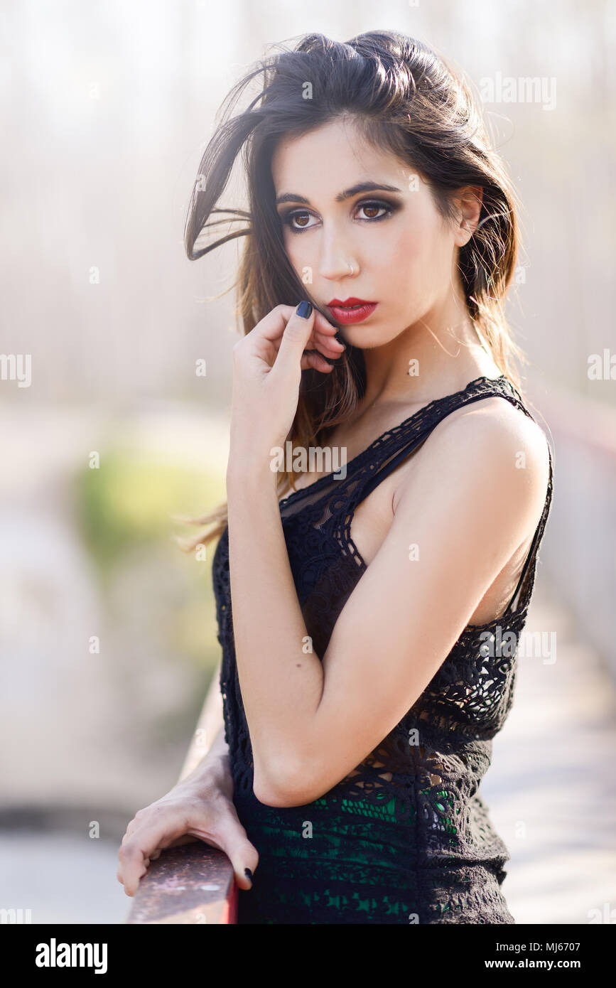 Portrait of beautiful young woman wearing long dress in a forest Stock ...