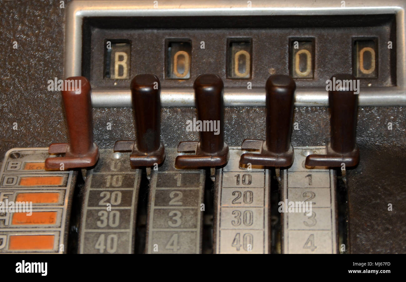 Closeup on vintage cash register with sliders instead of buttons. Stock Photo