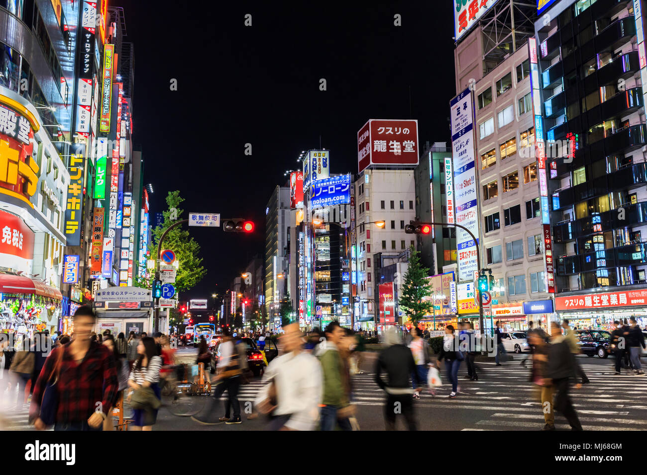 Tokyo, Japan - October 26, 2014: People walking along the streets of Shinjuku shopping at night, Shinjuku is a special wards located in Tokyo Metropol Stock Photo