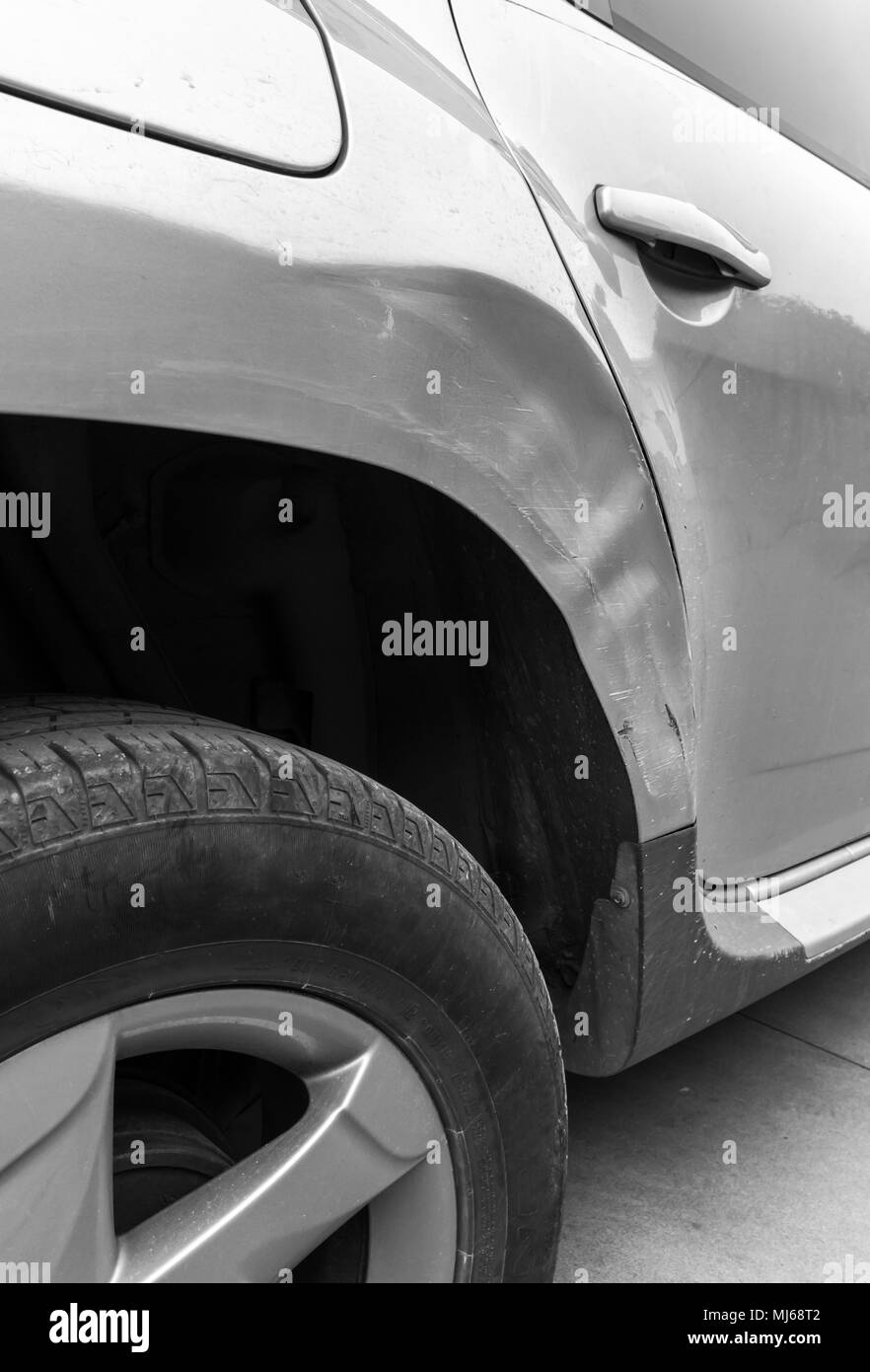 Dents on the car caused by the accident. Close-up. Stock Photo
