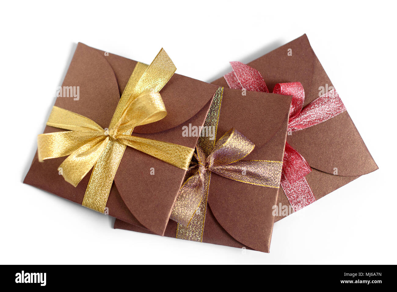 Opened square brown paper gift box and white lid tied up with