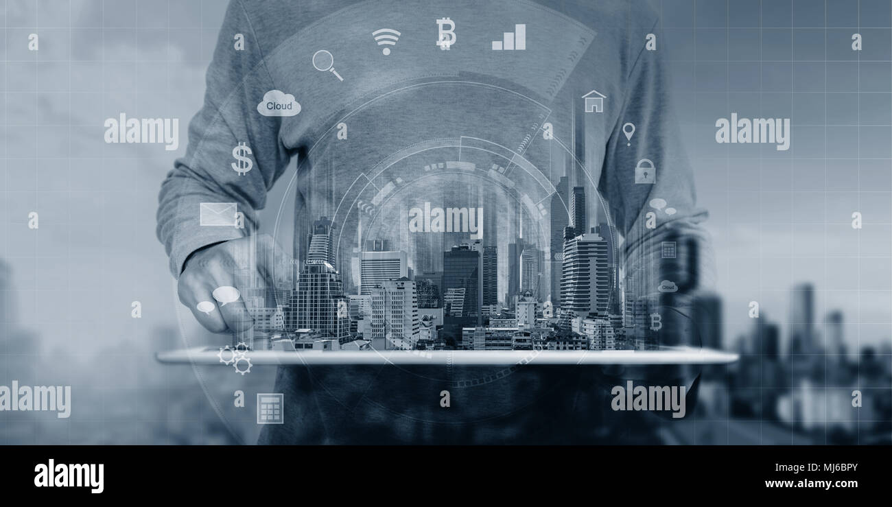 a man using digital tablet and interface application icons technology Stock Photo