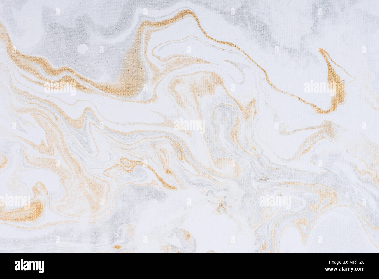 White paper sheet texture background. Flowing colors. Golden and silver fluid color pattern. Stock Photo