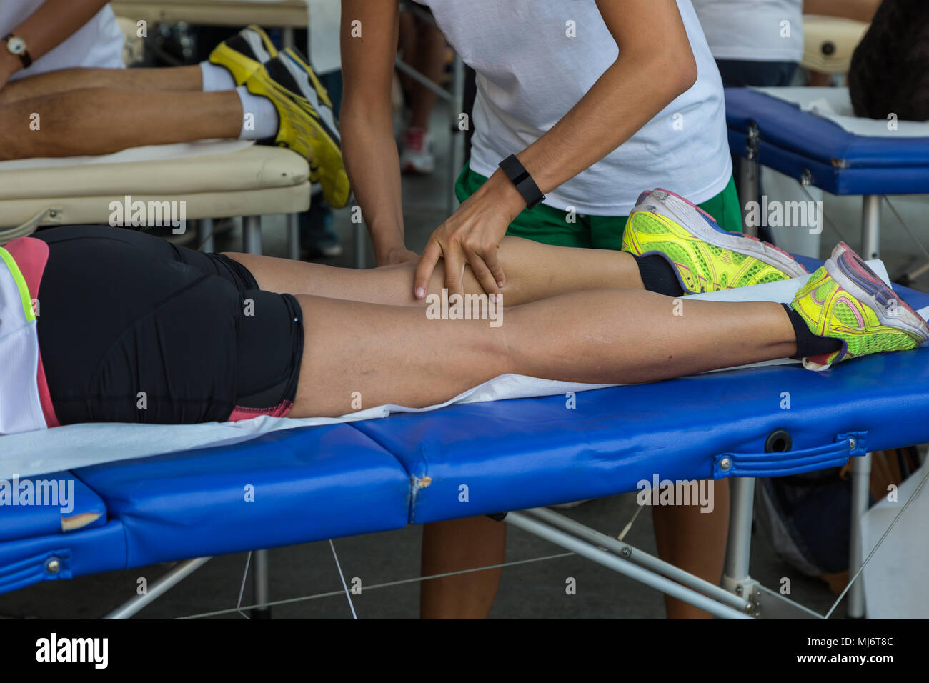 Athlete's Muscles Massage after Sport Workout Healthcare Theme Stock