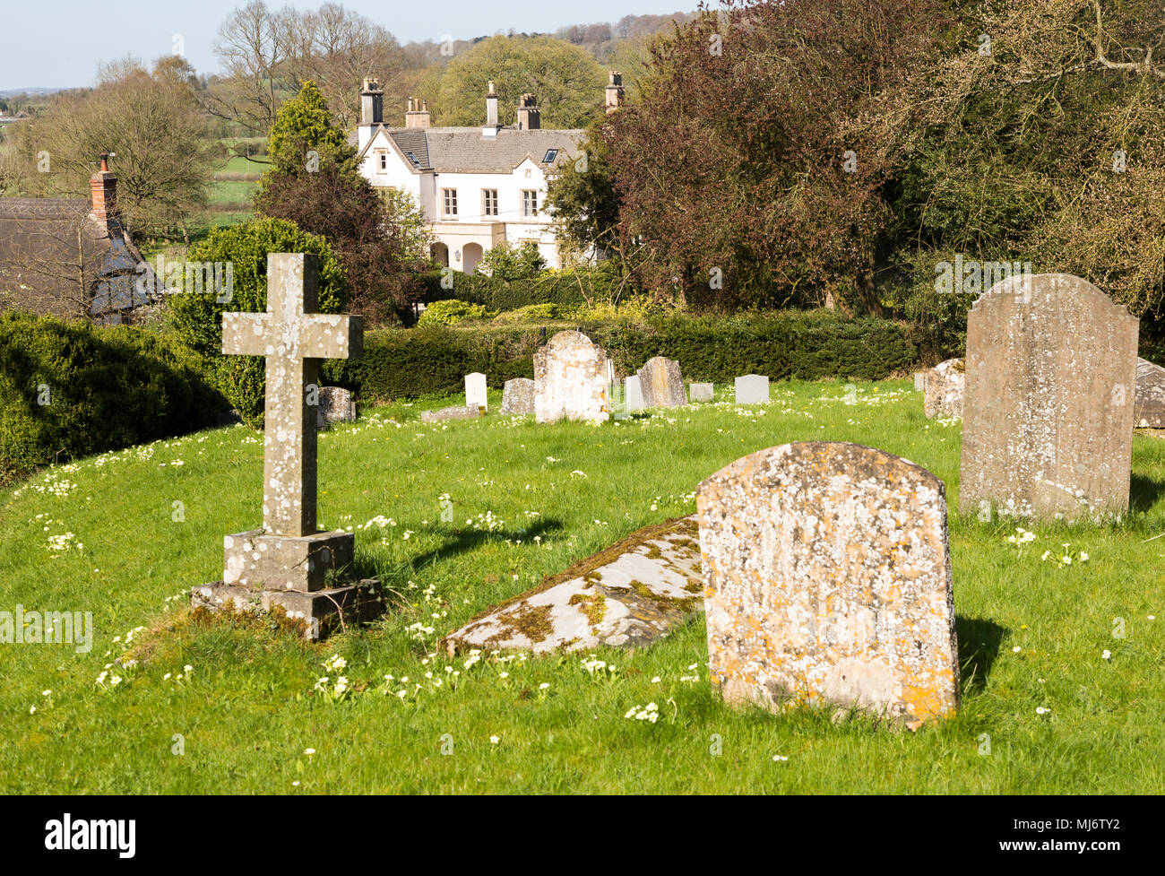 Churchyard of Saint Within, village houses, Compton Bassett, Wiltshire, England, UK Stock Photo