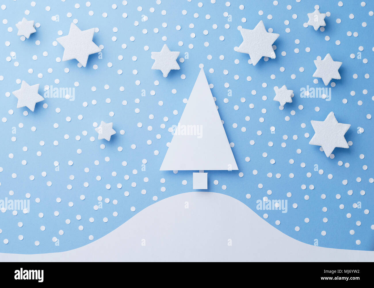 Paper Christmas Tree Stars And Snow Cut From White Over Blue Background Top View Paper Christmas Tree Stars And Snow Cut From White Over Blue Background Top View