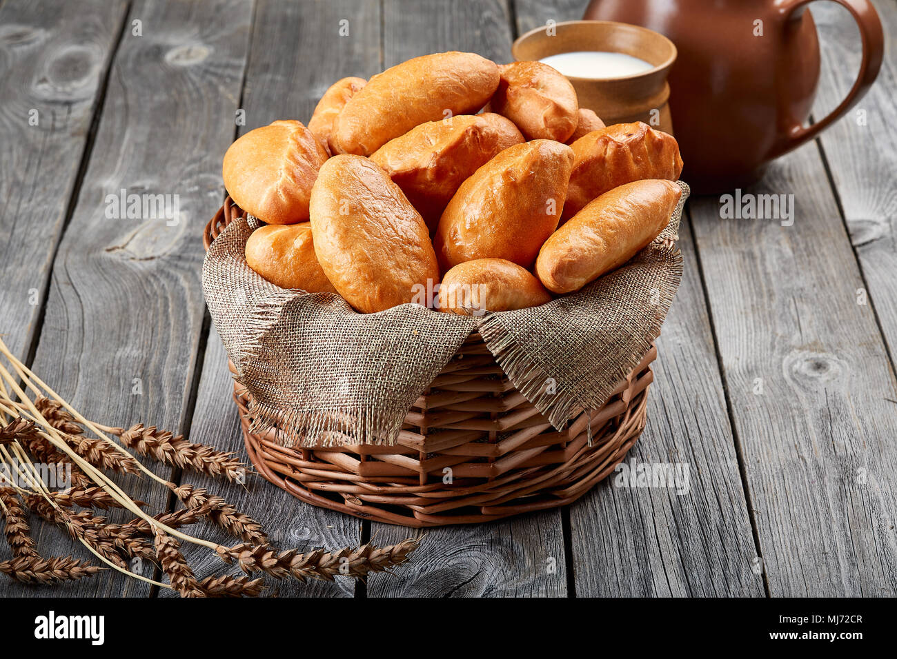 Homemade pies from the oven lie on in the basket. Traditional bakery