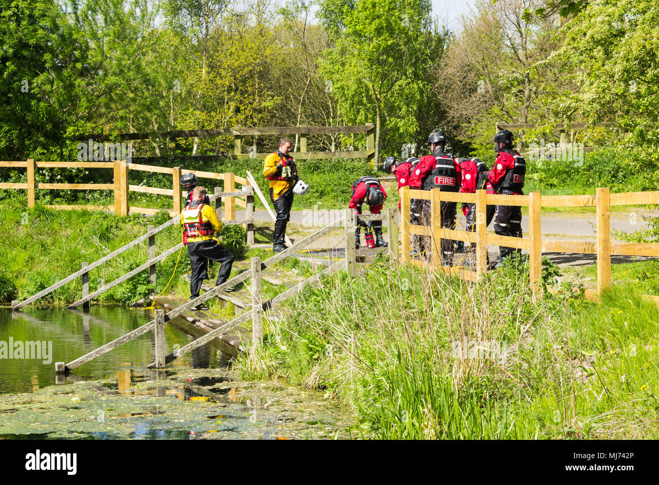 Members of Greater Manchester Fire and Rescue Service undertaking water rescue training at Burrs Activity Centre, Burrs Country Park, Bury. Stock Photo