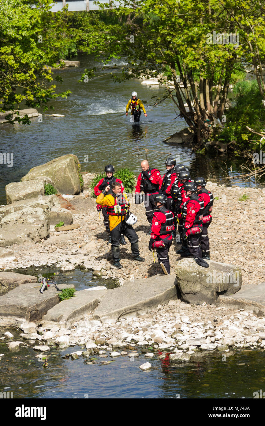 Members of Greater Manchester Fire and Rescue Service undertaking water rescue training in the River Irwell near Burrs Activity Centre, Bury. Stock Photo