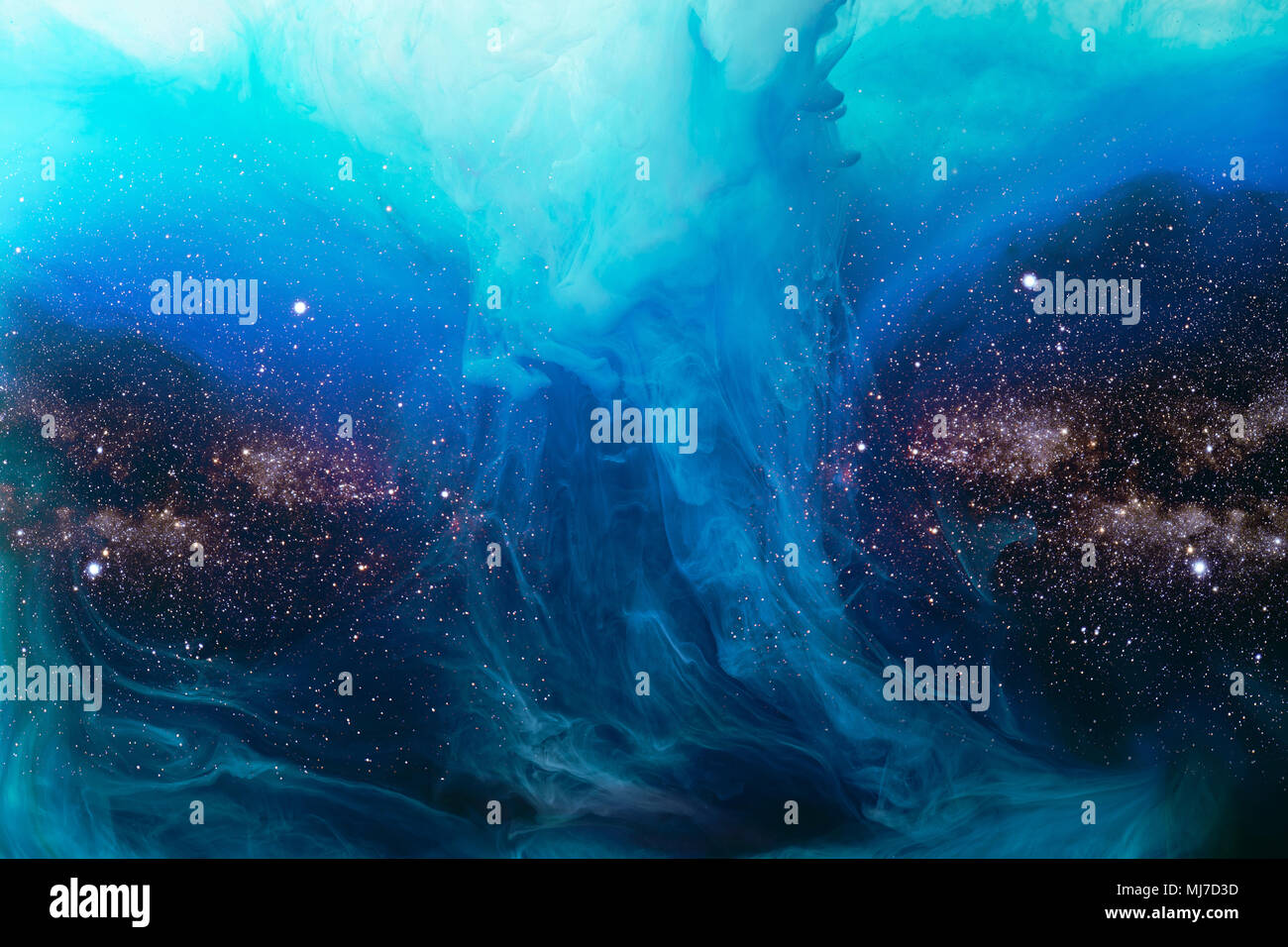 full frame image of mixing blue paint splashes in water with universe background Stock Photo