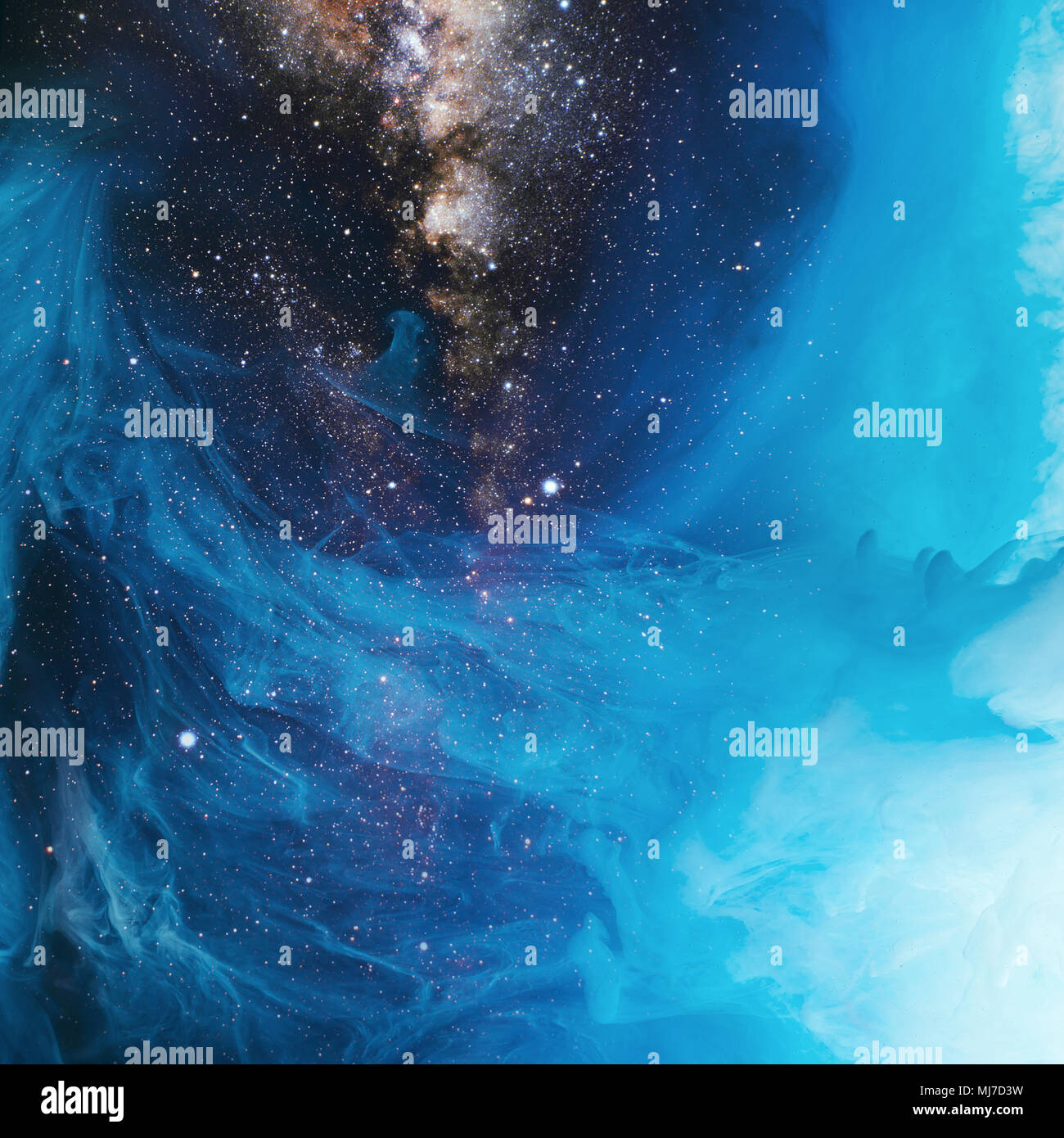 full frame image of mixing blue and black paint splashes in water with universe background Stock Photo