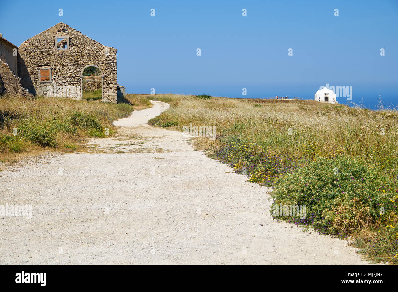 Path near the 15th century Our Lady of the Cape or Nossa Senhora do Cabo Church in Sesimbra, Portugal Stock Photo