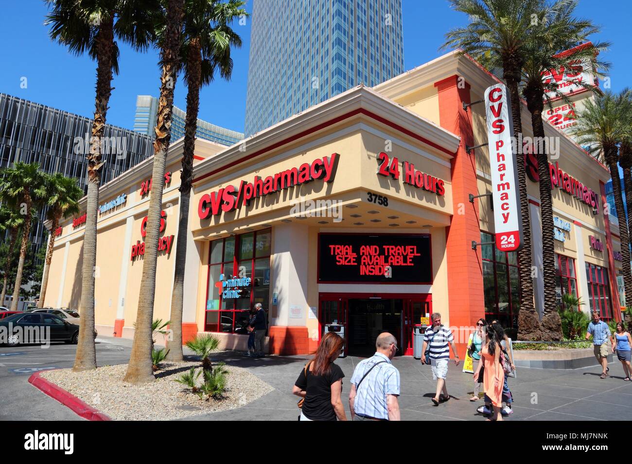 LAS VEGAS, USA - APRIL 14, 2014: People walk by CVS Pharmacy at the famous Strip in Las Vegas. CVS is the 2nd largest pharmacy chain in the USA with 7 Stock Photo