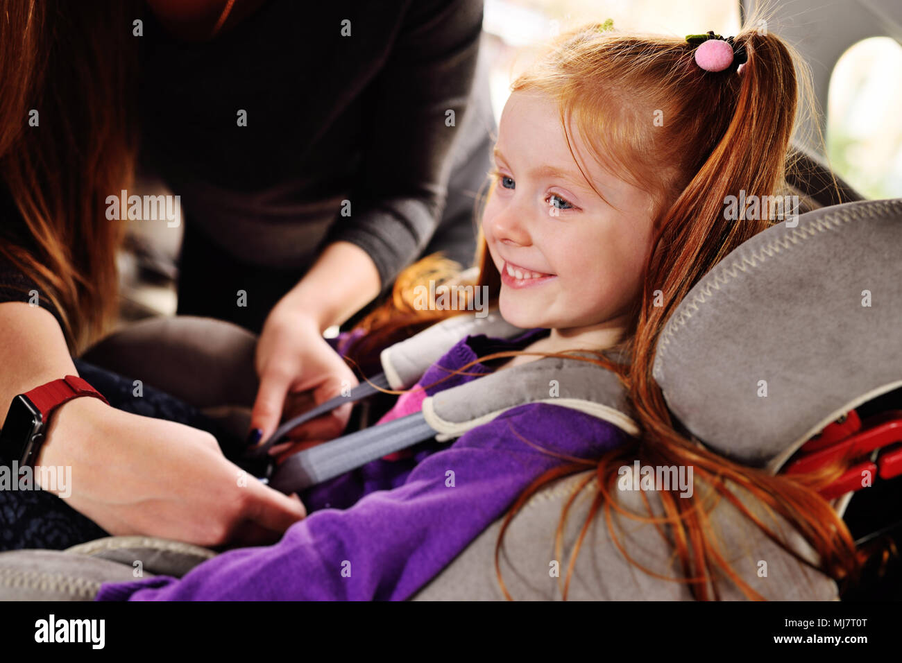 A red-haired girl smiles in the car Stock Photo - Alamy