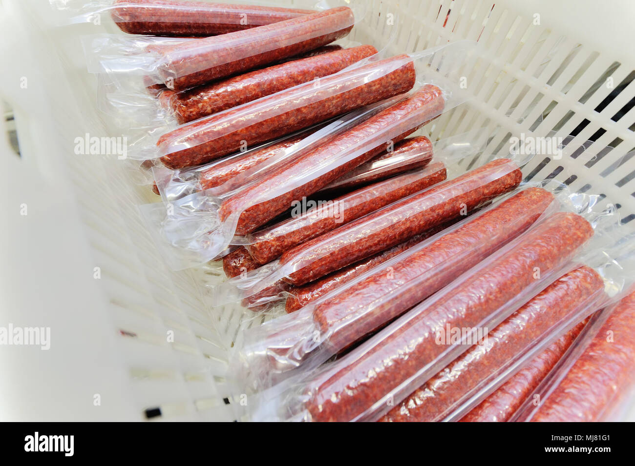 Sausages hanging in a smoking chamber closeup Stock Photo Alamy