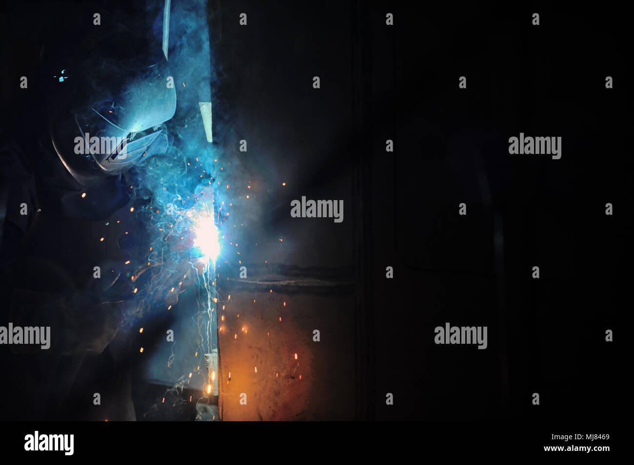 Worker welding with mig-mag method Stock Photo - Alamy