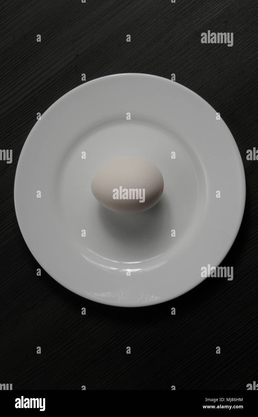 White egg on the plate Stock Photo